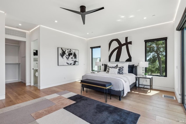 bedroom with ceiling fan, recessed lighting, wood finished floors, and visible vents