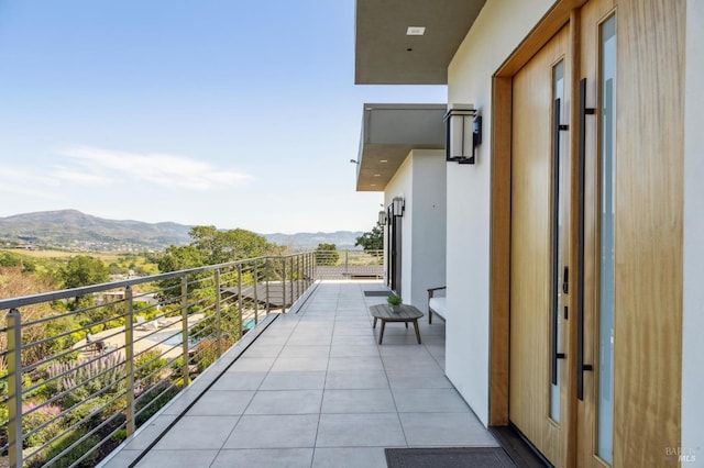balcony featuring a mountain view