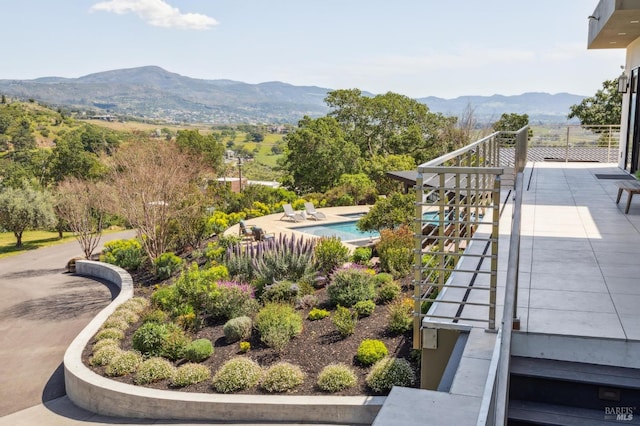 exterior space with a mountain view and a pool