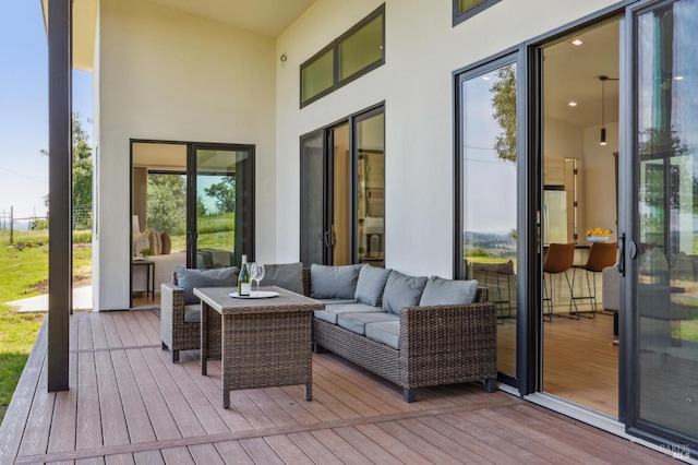 wooden deck featuring outdoor lounge area