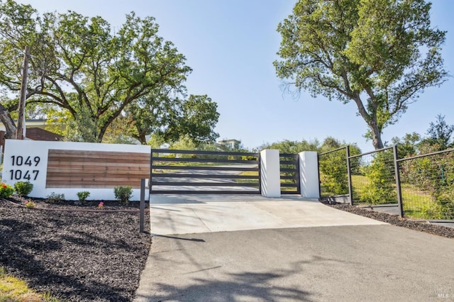 view of gate with fence