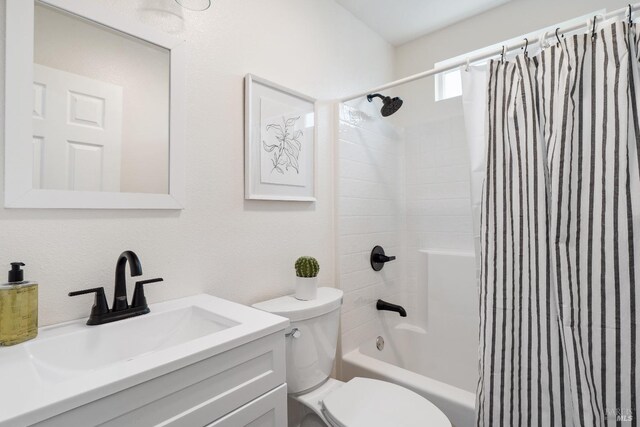 bathroom featuring toilet, vanity, and shower / bathtub combination with curtain