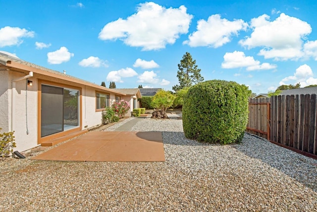 view of yard with a patio area and fence