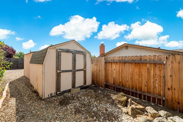 view of shed with a fenced backyard