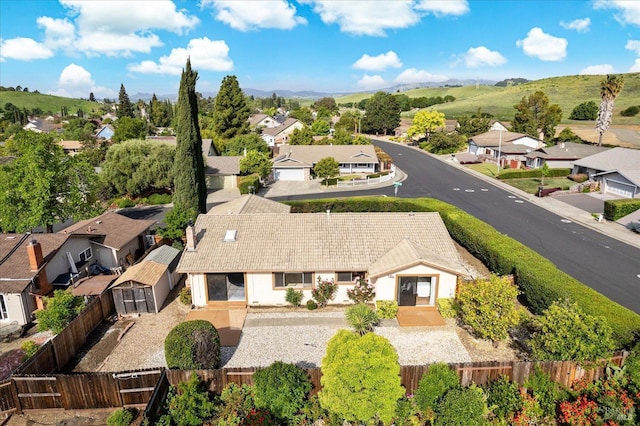 birds eye view of property with a mountain view and a residential view