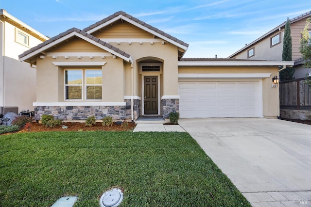 craftsman inspired home with an attached garage, concrete driveway, a front yard, and stucco siding