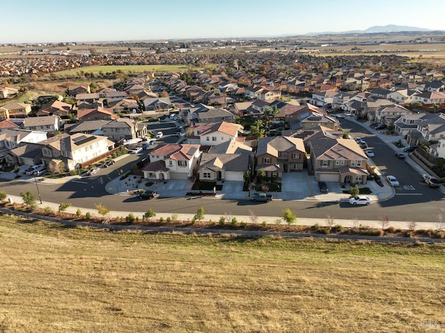 birds eye view of property featuring a mountain view and a residential view
