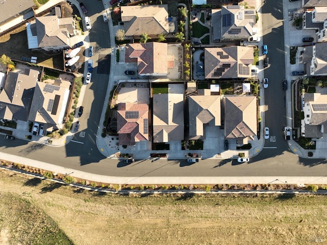 birds eye view of property with a residential view