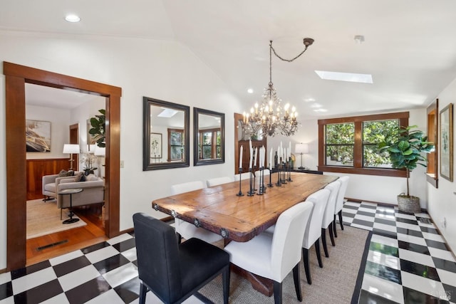 dining room featuring visible vents, recessed lighting, a notable chandelier, vaulted ceiling with skylight, and dark floors