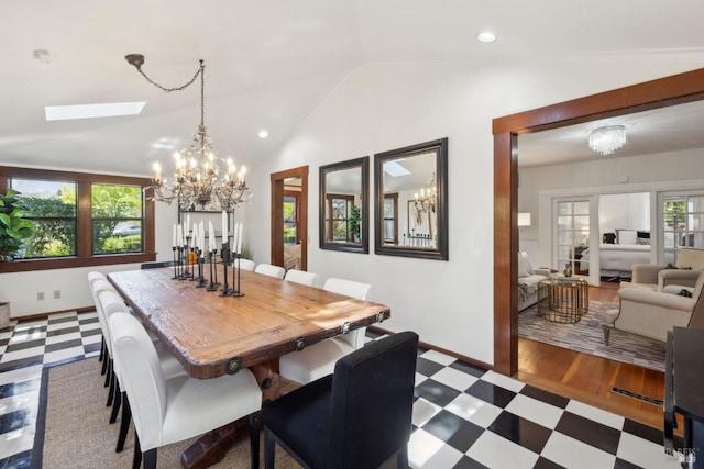 dining area featuring recessed lighting, tile patterned floors, an inviting chandelier, lofted ceiling with skylight, and baseboards