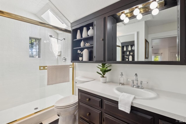 bathroom featuring a shower stall, toilet, and vanity
