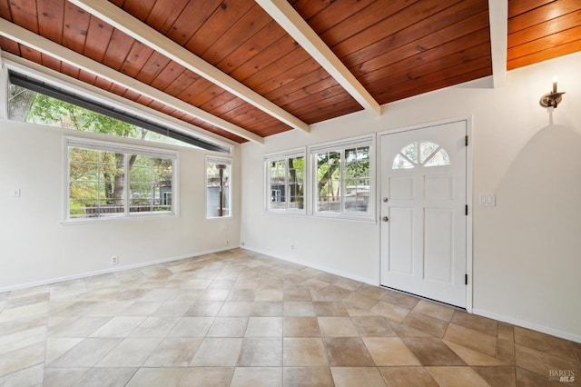foyer featuring lofted ceiling with beams, baseboards, light tile patterned floors, and wood ceiling