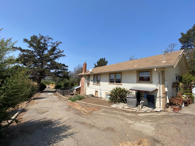 view of front of house with a chimney