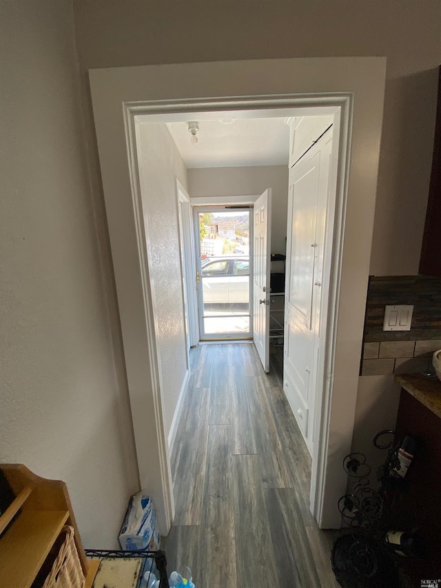hallway with wood finished floors