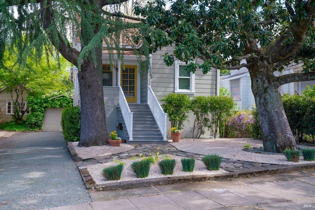 view of front of property with a porch and stairs