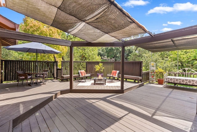 wooden deck featuring an outdoor fire pit