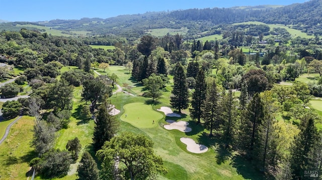 aerial view with a mountain view and golf course view