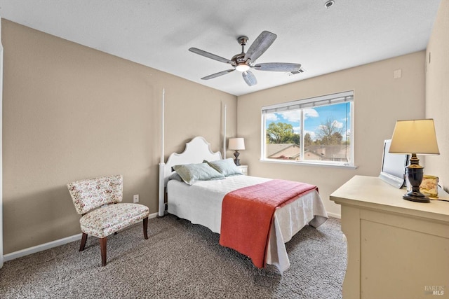 carpeted bedroom featuring visible vents, a ceiling fan, and baseboards