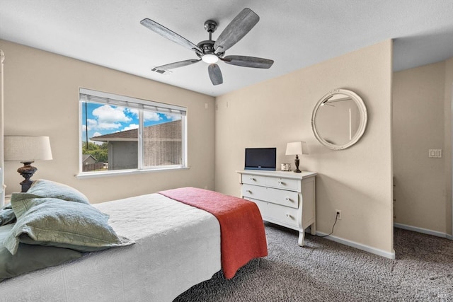 carpeted bedroom with baseboards and ceiling fan