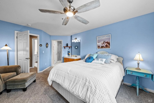 carpeted bedroom featuring a ceiling fan, baseboards, and connected bathroom