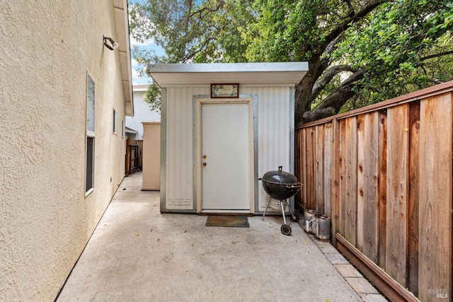 view of shed with fence