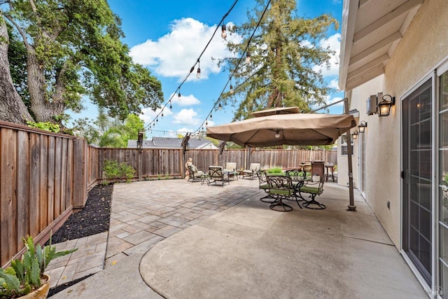 view of patio / terrace with a fenced backyard and outdoor dining area