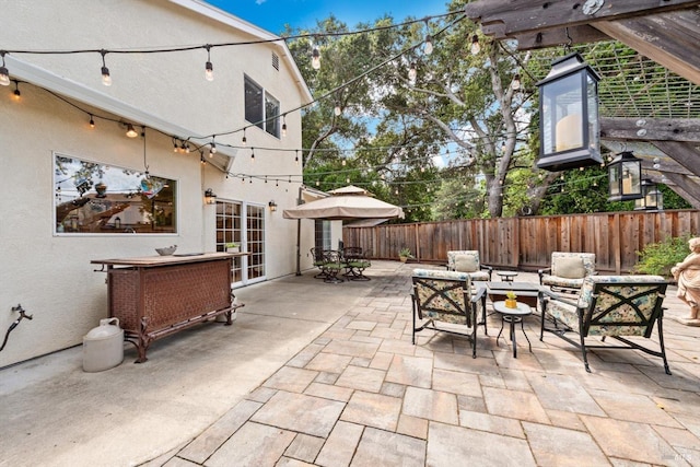 view of patio featuring fence and outdoor lounge area