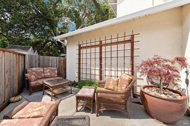 view of patio with a fenced backyard and an outdoor living space