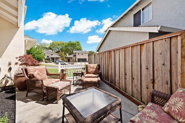 view of patio with fence and an outdoor living space