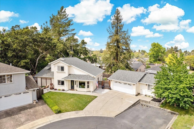 view of front of home featuring fence, a shingled roof, a front lawn, concrete driveway, and stucco siding