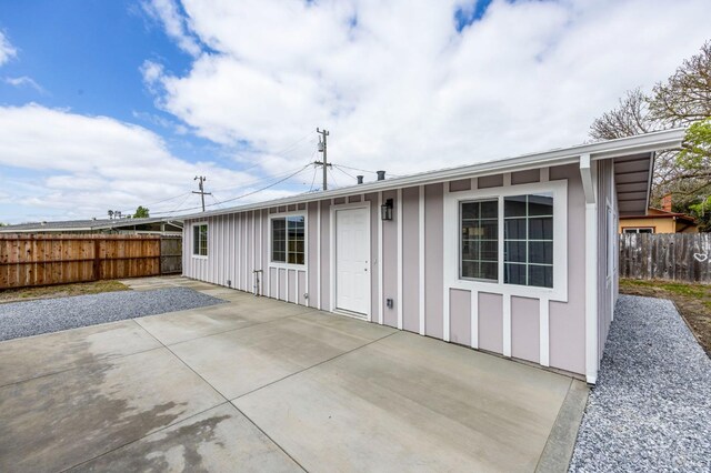 240 Rinaldo Dr, Vallejo, CA 94589 - back of property featuring fence, board and batten siding, and a patio