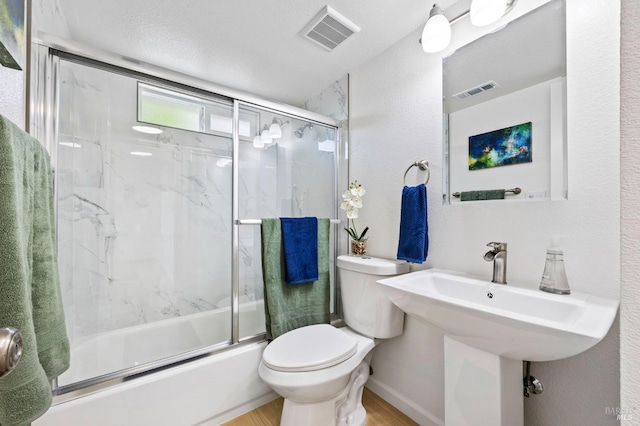240 Rinaldo Dr, Vallejo, CA 94589 - full bathroom featuring toilet, bath / shower combo with glass door, wood finished floors, and visible vents