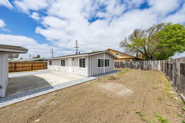 240 Rinaldo Dr, Vallejo, CA 94589 - back of house featuring a fenced backyard, a patio area, and board and batten siding