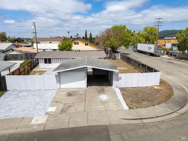 240 Rinaldo Dr, Vallejo, CA 94589 - view of front of home with a carport, driveway, fence private yard, and a garage