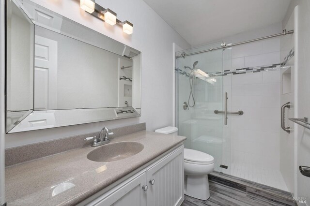 331 Laurel Leaf Pl, Santa Rosa, CA 95409 - bathroom with wood finished floors, vanity, toilet, and a stall shower