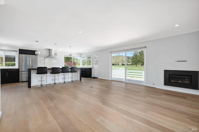 331 Laurel Leaf Pl, Santa Rosa, CA 95409 - unfurnished living room with recessed lighting, baseboards, a glass covered fireplace, and light wood-style flooring