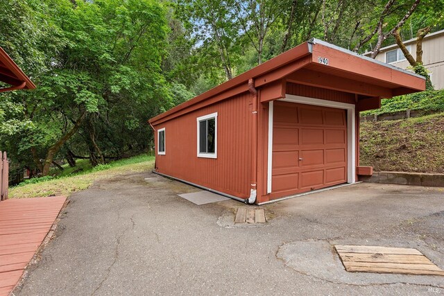 detached garage featuring driveway