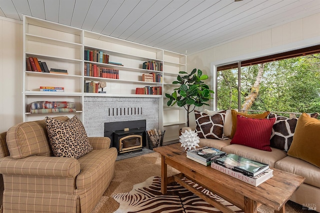 living area featuring wooden ceiling, built in features, and carpet flooring