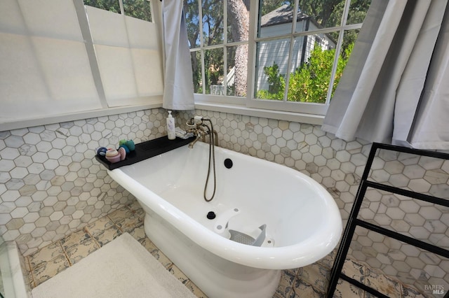full bathroom with a freestanding tub