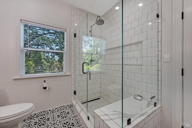 full bath featuring toilet, a relaxing tiled tub, tile patterned flooring, and tiled shower