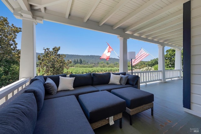 wooden deck featuring outdoor lounge area