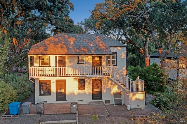 view of front facade featuring a patio and stairway