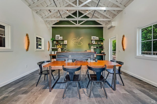 bar with baseboards, high vaulted ceiling, and a healthy amount of sunlight