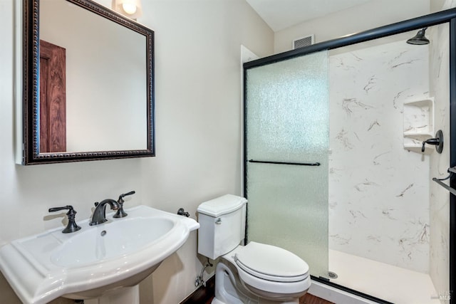 542 College Ave, Santa Rosa, CA 95404 - bathroom with visible vents, a sink, a shower stall, and toilet