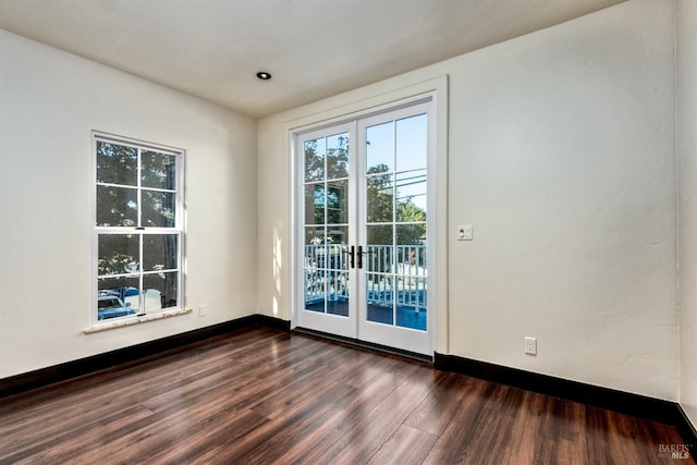 542 College Ave, Santa Rosa, CA 95404 - empty room with french doors, baseboards, and dark wood finished floors