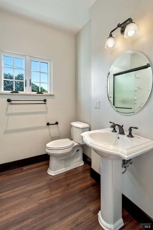 542 College Ave, Santa Rosa, CA 95404 - bathroom with baseboards, toilet, wood finished floors, and a sink