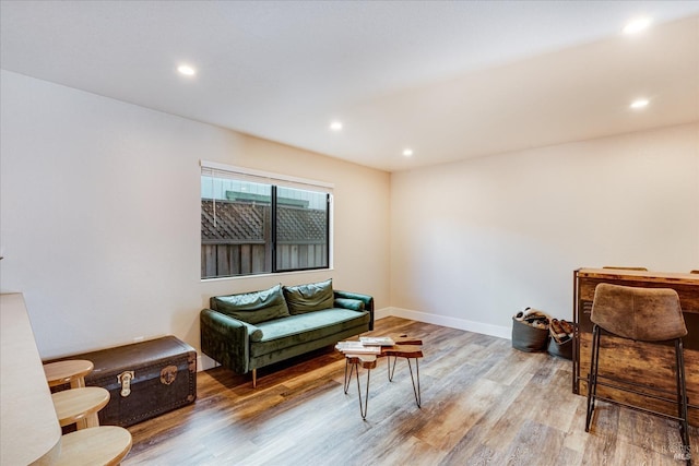interior space featuring light wood-style flooring, baseboards, and recessed lighting