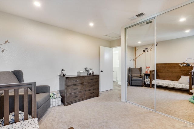 bedroom with recessed lighting, a closet, carpet, and visible vents