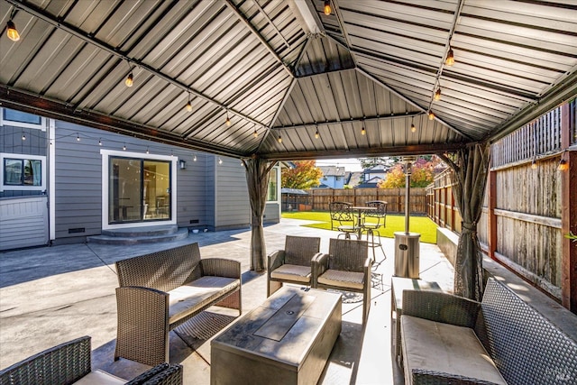 view of patio / terrace with a fenced backyard, a gazebo, and outdoor lounge area