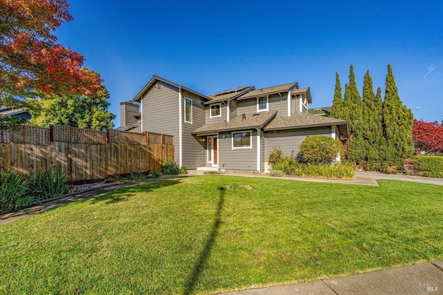 view of front of property with fence, a front lawn, and roof with shingles